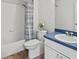Bathroom featuring a tub, shower, toilet, vanity with blue counter at 7209 49Th E Pl, Palmetto, FL 34221