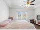 Bedroom features a bed and sliding glass doors leading to the pool area at 7209 49Th E Pl, Palmetto, FL 34221