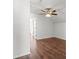 Bedroom featuring a ceiling fan, wood floor and open entry to other room at 7209 49Th E Pl, Palmetto, FL 34221