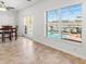 Dining room with seating for four and view of screened lanai and pool at 7209 49Th E Pl, Palmetto, FL 34221