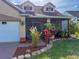 Charming home featuring a two-car garage, well-manicured lawn, and inviting, screened-in patio at 7209 49Th E Pl, Palmetto, FL 34221