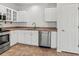 Renovated kitchen features stainless steel appliances, white cabinets and light countertops at 7209 49Th E Pl, Palmetto, FL 34221