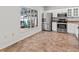 Updated kitchen features stainless steel appliances, white cabinets and light countertops, and eat in space at 7209 49Th E Pl, Palmetto, FL 34221