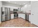 Updated kitchen features stainless steel appliances, white cabinets and light countertops at 7209 49Th E Pl, Palmetto, FL 34221