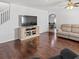 Inviting living room with hardwood floors, a neutral color palette, and archway to dining area at 7209 49Th E Pl, Palmetto, FL 34221