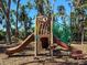 Community playground with a slide and climbing area, perfect for to have fun and stay active at 7209 49Th E Pl, Palmetto, FL 34221
