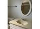Bathroom with single vanity and oval mirror at 7861 Pine Trace Dr # 7861, Sarasota, FL 34243