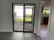 View of a patio through sliding glass doors at 7861 Pine Trace Dr # 7861, Sarasota, FL 34243