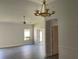 Bright living room with chandelier and ceiling fan at 7861 Pine Trace Dr # 7861, Sarasota, FL 34243