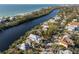 Beautiful waterfront home with private dock and lush landscaping at 8030 Midnight Pass Rd, Sarasota, FL 34242
