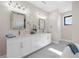 Spacious bathroom with double vanity, marble countertops, and large mirrors at 8030 Midnight Pass Rd, Sarasota, FL 34242