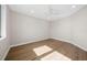 Spacious bedroom with hardwood floors and natural light at 8030 Midnight Pass Rd, Sarasota, FL 34242
