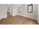 Bright bedroom with hardwood floors and large windows offering natural light at 8030 Midnight Pass Rd, Sarasota, FL 34242
