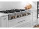 Close-up of a stainless steel gas cooktop with gold accents at 8030 Midnight Pass Rd, Sarasota, FL 34242