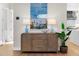 Entryway with console table, lamps, and large artwork at 8030 Midnight Pass Rd, Sarasota, FL 34242