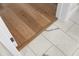 Transition between wood and marble tile flooring at 8030 Midnight Pass Rd, Sarasota, FL 34242