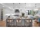 Spacious kitchen with island, stainless steel appliances, and white cabinetry at 8030 Midnight Pass Rd, Sarasota, FL 34242