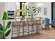 Modern kitchen with white cabinets, quartz countertops, and kitchen island at 8030 Midnight Pass Rd, Sarasota, FL 34242
