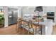 Modern kitchen boasts stainless steel appliances and a large island at 8030 Midnight Pass Rd, Sarasota, FL 34242
