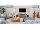 Relaxing living room with comfy seating, a large TV, and a neutral color scheme at 8030 Midnight Pass Rd, Sarasota, FL 34242