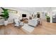 Spacious living room with hardwood floors and views to the kitchen and entry at 8030 Midnight Pass Rd, Sarasota, FL 34242