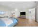 Main bedroom with king bed, sitting area, and ensuite bathroom access at 8030 Midnight Pass Rd, Sarasota, FL 34242