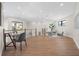 Light-filled home office with a desk and chair, hardwood floors and a view at 8030 Midnight Pass Rd, Sarasota, FL 34242