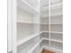 Large walk-in pantry with white shelving offering generous storage at 8030 Midnight Pass Rd, Sarasota, FL 34242