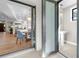 Modern powder room with pedestal sink and frosted glass door at 8030 Midnight Pass Rd, Sarasota, FL 34242