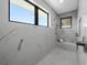 Spa-like shower with marble tile, built-in seat, and dual shower heads at 8030 Midnight Pass Rd, Sarasota, FL 34242