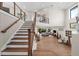 Modern staircase with wood and cable railing, overlooking the living room at 8030 Midnight Pass Rd, Sarasota, FL 34242