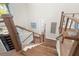 Stunning staircase with hardwood and cable railing at 8030 Midnight Pass Rd, Sarasota, FL 34242