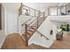 Contemporary staircase with wood and metal accents, leading to an upper level at 8030 Midnight Pass Rd, Sarasota, FL 34242