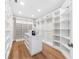 Large walk-in closet with ample shelving and hanging space at 8030 Midnight Pass Rd, Sarasota, FL 34242