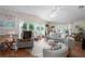 Living room with comfortable seating and large windows at 8454 Imperial Cir, Palmetto, FL 34221
