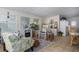 Bright sunroom with comfortable seating and a cozy fireplace at 8454 Imperial Cir, Palmetto, FL 34221