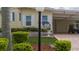 Well-maintained manufactured home with mature landscaping and paved driveway at 8454 Imperial Cir, Palmetto, FL 34221