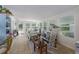 Relaxing sunroom with ample natural light, comfortable seating, and tiled floors at 8454 Imperial Cir, Palmetto, FL 34221
