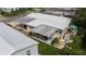 Aerial view of a mobile home with deck and covered patio at 8454 Imperial Cir, Palmetto, FL 34221