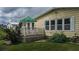 Spacious deck with patio furniture and lush landscaping at 8454 Imperial Cir, Palmetto, FL 34221