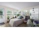 Sunroom with a daybed and comfortable seating, bathed in sunlight at 8454 Imperial Cir, Palmetto, FL 34221