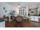 Bright dining room with glass table and chairs at 8454 Imperial Cir, Palmetto, FL 34221