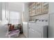 Laundry room with washer, dryer and storage at 8454 Imperial Cir, Palmetto, FL 34221