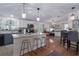 Open concept kitchen with island and hardwood floors at 8454 Imperial Cir, Palmetto, FL 34221