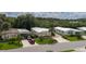 Aerial view of three mobile homes showcasing landscaping and street view at 8454 Imperial Cir, Palmetto, FL 34221