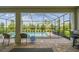 Inviting pool area with screened enclosure and outdoor seating at 2783 Butterfly Jasmine Trl, Sarasota, FL 34240