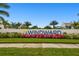 Windward community entrance with landscaping and signage at 2783 Butterfly Jasmine Trl, Sarasota, FL 34240