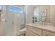 Modern bathroom with a walk-in shower, quartz countertop, and stylish fixtures at 1959 Hibiscus St, Sarasota, FL 34239