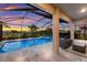 Enclosed pool and spa with lounge seating and sunset views at 3717 Savanna Palms Ct, Lakewood Ranch, FL 34211