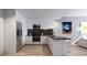 Modern kitchen with white cabinets and black marble at 2170 Robinhood Street # A4-102, Sarasota, FL 34231